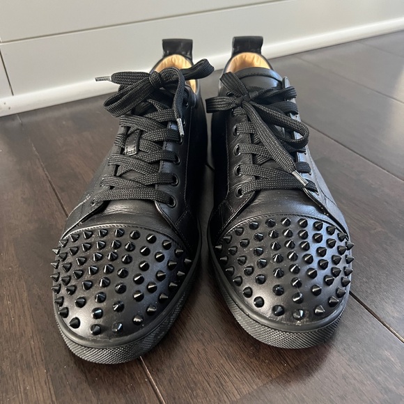 Men’s black low tops with spikes Christian Louboutin sneakers. In good condition